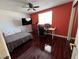 Bedroom with hardwood floors, a modern ceiling fan, and a large window at 2913 Domino Way, Las Vegas, NV 89117