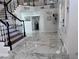 Bright foyer with marble floors, staircase, and coat rack near the door, creating a welcoming entrance at 2913 Domino Way, Las Vegas, NV 89117