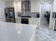 Well-equipped kitchen featuring stainless steel appliances, white cabinetry, and quartz countertops at 2913 Domino Way, Las Vegas, NV 89117