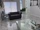 Bright living room featuring a gray sofa, modern decor, and luxurious marble flooring at 2913 Domino Way, Las Vegas, NV 89117