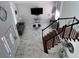 Open-concept living room with marble floors, stylish decor, and staircase, creating a modern space at 2913 Domino Way, Las Vegas, NV 89117