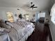 Comfortable main bedroom with dark wood floors leading to an ensuite bathroom and sitting area at 2913 Domino Way, Las Vegas, NV 89117