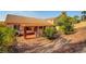The backyard showcases a covered patio and rock landscaping, providing a serene outdoor space at 3071 Misty Moon Ave, Henderson, NV 89052