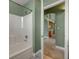 Bathroom features a pristine white tub with a tiled wall, complemented by green walls at 3071 Misty Moon Ave, Henderson, NV 89052