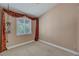 Bright bedroom featuring plush carpeting and a window beautifully draped in patterned fabric at 3071 Misty Moon Ave, Henderson, NV 89052