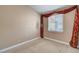 Cozy bedroom showcasing soft carpet and a well-lit window accented by decorative curtains at 3071 Misty Moon Ave, Henderson, NV 89052