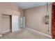 Carpeted bedroom boasts generous closet space and stylish draped window decor at 3071 Misty Moon Ave, Henderson, NV 89052