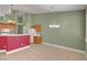 Spacious kitchen and dining area with white appliances and custom bar at 3071 Misty Moon Ave, Henderson, NV 89052