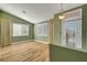 Inviting living area featuring wood floors, ample windows, and neutral decor at 3071 Misty Moon Ave, Henderson, NV 89052