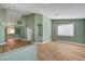Spacious living room with wood floors, fresh paint, and abundant natural light at 3071 Misty Moon Ave, Henderson, NV 89052