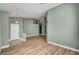 Large living space with wood floors, neutral wall color and modern lighting at 3071 Misty Moon Ave, Henderson, NV 89052