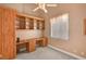 Office space with custom built-in shelving and cabinetry, providing ample storage and workspace at 3071 Misty Moon Ave, Henderson, NV 89052