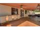 Spacious covered patio features a ceiling fan, outdoor furniture, and ample space for entertaining at 3071 Misty Moon Ave, Henderson, NV 89052