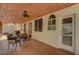 Comfortable patio with ceiling fan, featuring an outdoor dining set for relaxation and gatherings at 3071 Misty Moon Ave, Henderson, NV 89052