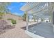 Landscaped backyard featuring a shaded patio, providing an ideal outdoor living space at 3109 Hawksdale Dr, Las Vegas, NV 89134