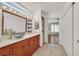 Bright bathroom featuring a vessel sink, wood cabinets, and decorative lighting at 3109 Hawksdale Dr, Las Vegas, NV 89134