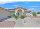 Charming home featuring a covered entrance, desert landscaping, and a warm, inviting facade at 3109 Hawksdale Dr, Las Vegas, NV 89134