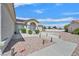 Inviting single-story home boasts desert landscaping, adding to the curb appeal at 3109 Hawksdale Dr, Las Vegas, NV 89134