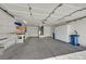 Spacious garage with concrete floors, built-in shelving, and ample storage at 3109 Hawksdale Dr, Las Vegas, NV 89134
