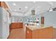 Bright kitchen featuring wood floors, granite countertops, a modern island, and stainless steel appliances at 3109 Hawksdale Dr, Las Vegas, NV 89134