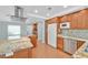 Modern kitchen with wood cabinets, granite counters, a white refrigerator, and stainless steel appliances at 3109 Hawksdale Dr, Las Vegas, NV 89134