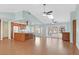 Spacious living room with hardwood floors, connecting to the kitchen, creating an open atmosphere at 3109 Hawksdale Dr, Las Vegas, NV 89134