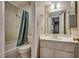 Cozy bathroom features a shower-tub combination and vanity at 3350 Duece St, Las Vegas, NV 89121