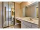 Spacious bathroom featuring tile floors and a vanity with a large mirror at 3350 Duece St, Las Vegas, NV 89121