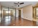 Large bedroom with mirrored closets, fan, hardwood floors, and bright window at 3350 Duece St, Las Vegas, NV 89121