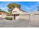 Exterior view of a property with a two-car garage and landscaping at 3350 Duece St, Las Vegas, NV 89121