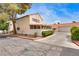 Two-story home with well-kept landscaping, neutral stucco exterior, and tile roof at 3350 Duece St, Las Vegas, NV 89121