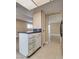 Partial view of kitchen island with dark countertop and cabinets at 3350 Duece St, Las Vegas, NV 89121