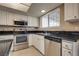 Well-lit kitchen featuring stainless steel appliances and stylish design at 3350 Duece St, Las Vegas, NV 89121