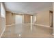 Bright living room with tile flooring, large windows, and access to other rooms at 3350 Duece St, Las Vegas, NV 89121