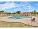 Community pool with a fenced perimeter and lounge chairs, perfect for recreation at 3350 Duece St, Las Vegas, NV 89121