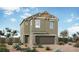 Charming two-story home featuring a stone-accented facade and a well-manicured front yard at 375 Silva Place Pl, Henderson, NV 89011