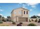 Charming two-story home with desert landscaping and a two-car garage against a blue sky at 3946 Garden Square Ave, Las Vegas, NV 89115