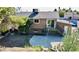 Backyard with patio, mature trees, privacy fence, and access to deck at 3950 Ventura Way, Las Vegas, NV 89121