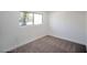 Comfortable bedroom featuring carpet flooring and natural light at 3950 Ventura Way, Las Vegas, NV 89121