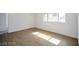 Bright bedroom featuring natural light with wood flooring and neutral walls at 3950 Ventura Way, Las Vegas, NV 89121