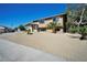Two-story home featuring a gravel yard, desert landscaping, and an attached garage at 3950 Ventura Way, Las Vegas, NV 89121