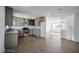 Spacious kitchen with stainless steel appliances, hardwood flooring, and an open layout, ideal for entertaining guests at 3950 Ventura Way, Las Vegas, NV 89121