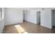 Open-concept living area showcasing hardwood flooring, natural light, and seamless flow between spaces, perfect for modern living at 3950 Ventura Way, Las Vegas, NV 89121