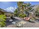 Inviting backyard featuring lush greenery, comfortable seating, and a shady patio area at 40 Trailside Ct, Henderson, NV 89012