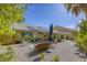 Serene backyard with solar panels, comfortable seating, and a well-maintained landscape at 40 Trailside Ct, Henderson, NV 89012