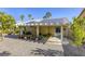 Beautiful backyard featuring covered patio, lush landscaping, and a relaxing seating area at 40 Trailside Ct, Henderson, NV 89012