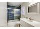 Updated bathroom with modern tile shower-tub, sink, and fixtures at 40 Trailside Ct, Henderson, NV 89012
