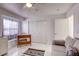 Bright bedroom featuring a comfortable sofa, wooden desk, and natural lighting at 40 Trailside Ct, Henderson, NV 89012