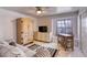 Comfortable bedroom with sofa, desk, storage furniture, and bright natural light at 40 Trailside Ct, Henderson, NV 89012
