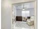 Living area with comfortable armchair, bookshelves and great natural lighting at 40 Trailside Ct, Henderson, NV 89012